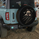 Cute Pug Peeking Through Torn Car Spare Tire Cover