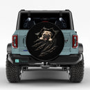 Cute Pug Peeking Through Torn Car Spare Tire Cover