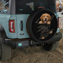 Golden Retriever Peeking Through Torn Car Spare Tire Cover