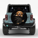 Golden Retriever Peeking Through Torn Car Spare Tire Cover