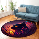 Cute Black Cat Bedded Down In The Grass Round Rug
