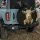 Goat In A Torn Fabric Jeep Car Spare Tire Cover