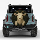 Goat In A Torn Fabric Jeep Car Spare Tire Cover